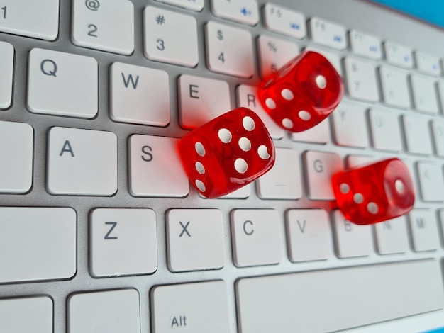 Playing dice and keyboard Online gambling and casino addiction concept