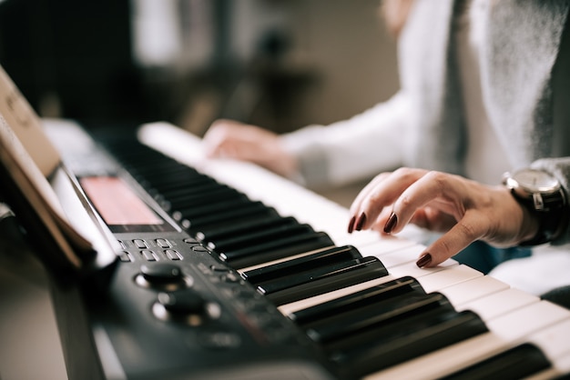 Playing piano. Close-up.