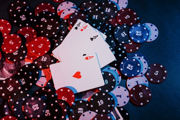 Playing poker chips, cards and money close up