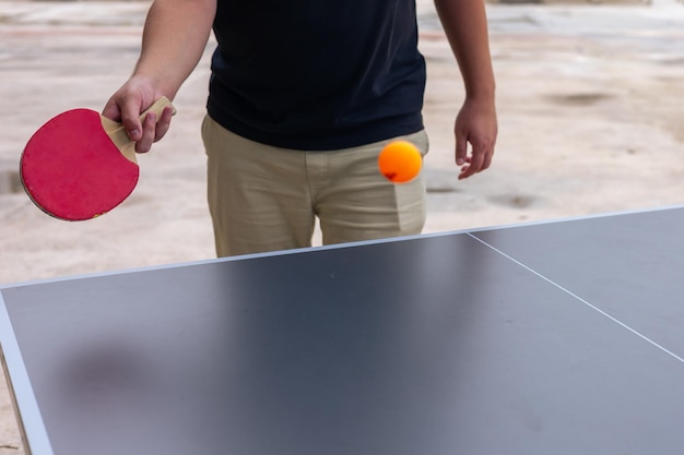 playing table tennis at a hotel in turkiye on a sunny afternoon by the pool