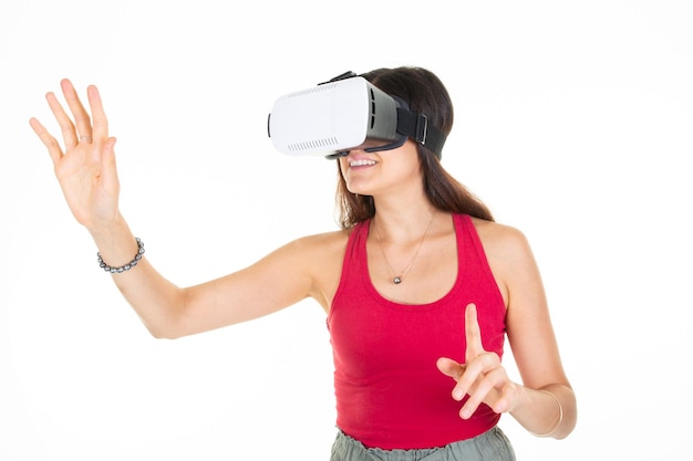 Playing vr positive woman wearing virtual reality goggles headset