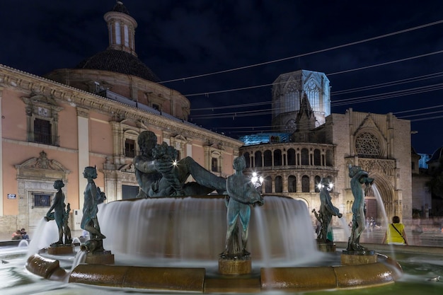 Plaza de la Virgen de Valencia in the foreground the Turia fountain Spain