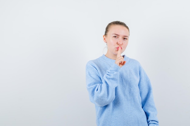 The pleasant girl is showing calmness emotion on white background