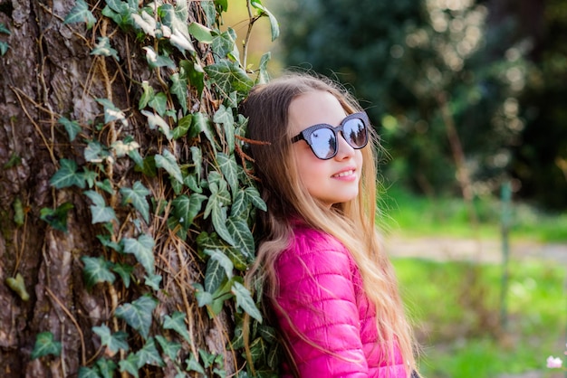 Pleasant relaxing walk in garden Peaceful environment garden Girl walk in botanical garden Enjoying nature in garden Kid cute fancy child spend time in park Plants grown for display to public