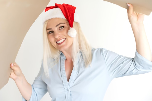 Pleasant woman opening cardboard box