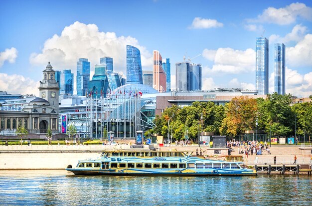 Pleasure ship Volna near the Kyiv pier on the Moscow River and Moscow City Moscow