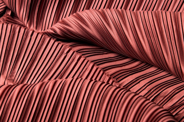 Pleat Fabric in long line drape with shadow pleated style of textile pattern in red burgundy color