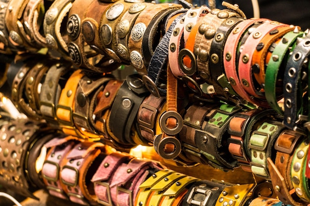 Plenty of colorful leather bracelets on a craft market