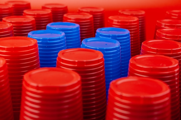 Plenty of plastic empty colorful cups close up