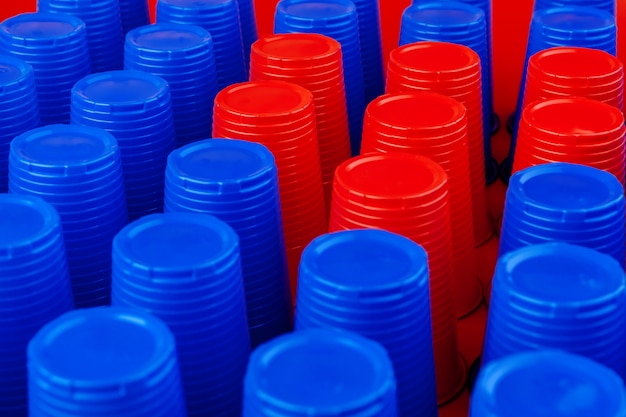 Plenty of plastic empty colorful cups close up