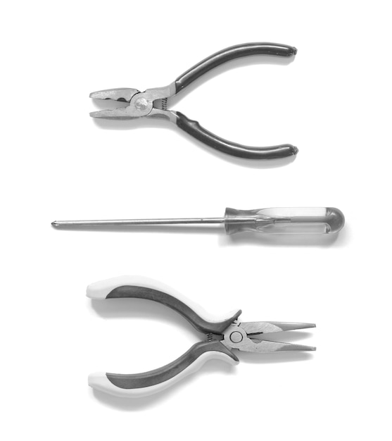 Pliers and screwdriver on a white background