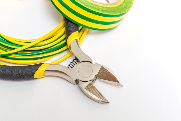 Pliers tool and wires for electrician closeup