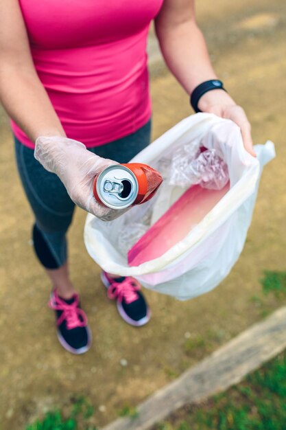 Plogging Girl showing garbage