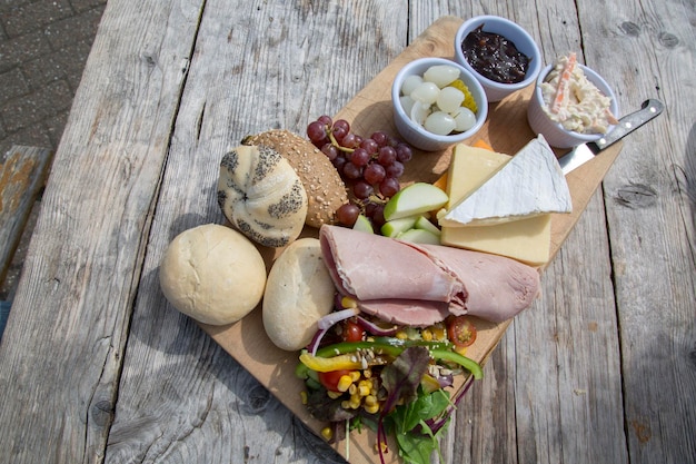 Ploughman Lunch in Sunlight on Wooden Table