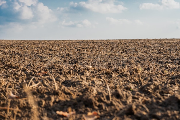 A plowed field dry land closeup