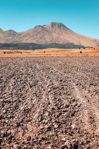 Plowed field and tillage with the extinct volcano Hassan Dag in the background Agriculture and travel in Turkey