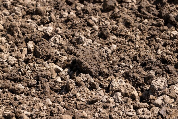 Plowed soil in an agricultural field during tillage