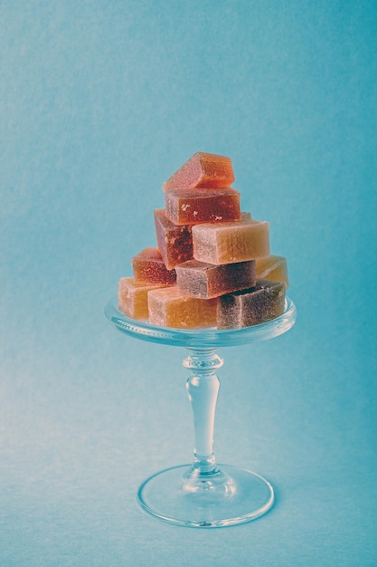 Plum and apple marmalade on a glass podium