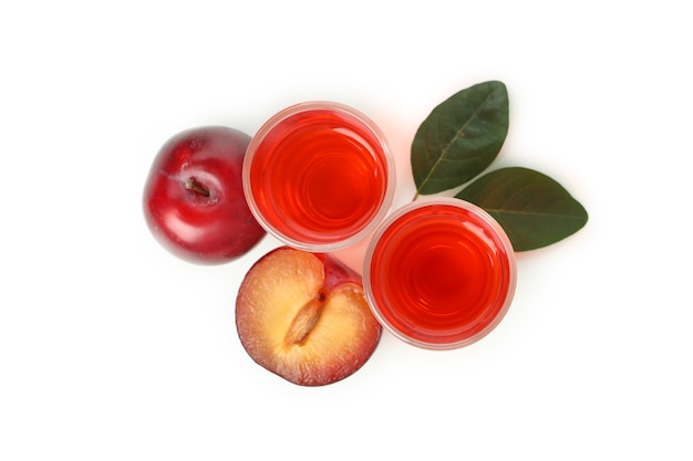 Plum brandy shots isolated on white background