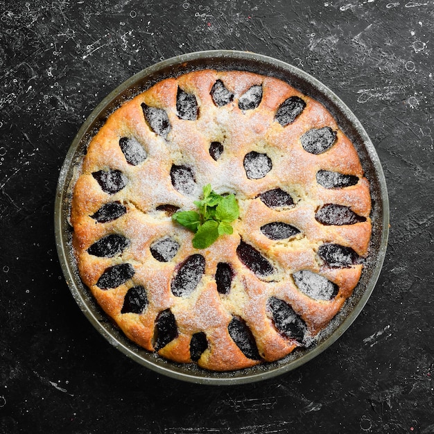 Plum traditional pie Baking Top view Rustic style