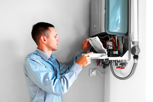 Plumber attaches Trying To Fix the Problem with the Residential Heating Equipment