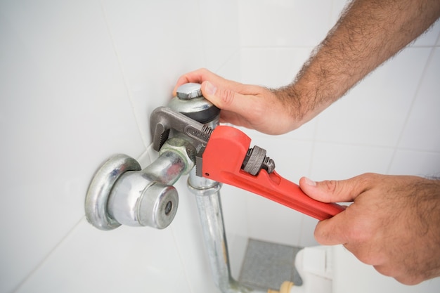 Plumber fixing tap with wrench