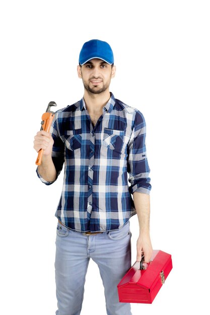 Photo plumber man carrying a wrench on studio