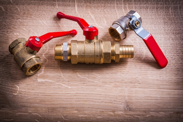 Plumbing Tools Composition Of Brass Pipe Connectors On Wooden Board