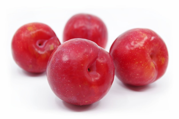 Plums isolated on white