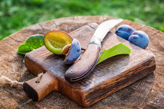 plums on wooden table