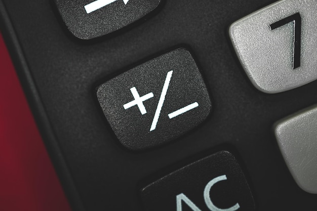 Plus and minus button on calculator close up. High quality photo