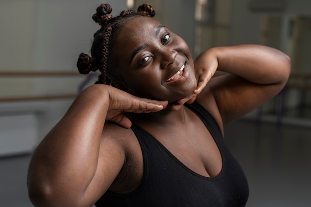 Plus-size ballerina practicing in the studio