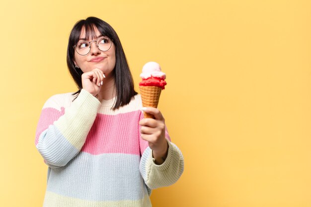 Plus size pretty woman with an ice cream