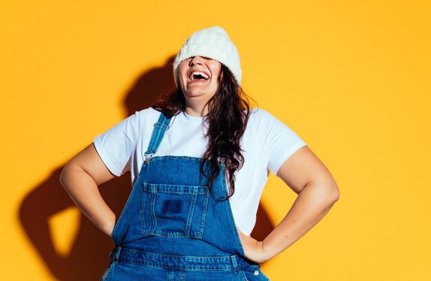 Plus size woman model posing in studio and having fun