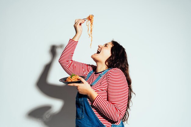 Plus size woman model posing in studio and having fun