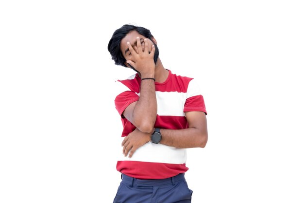 Png of man in a red and white shirt is covering his face with his hands and is looking up at the sky