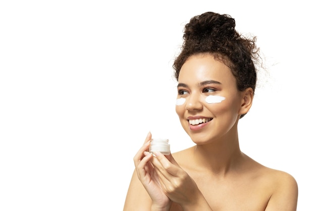 PNGattractive girl with face cream in handst isolated on white background