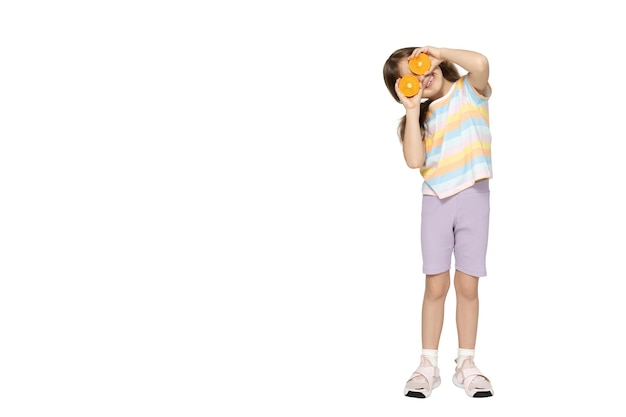 PNGlittle girl with oranges in her hands isolated on white background