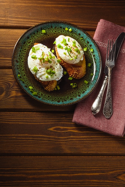 Poached eggs on baguette with greens