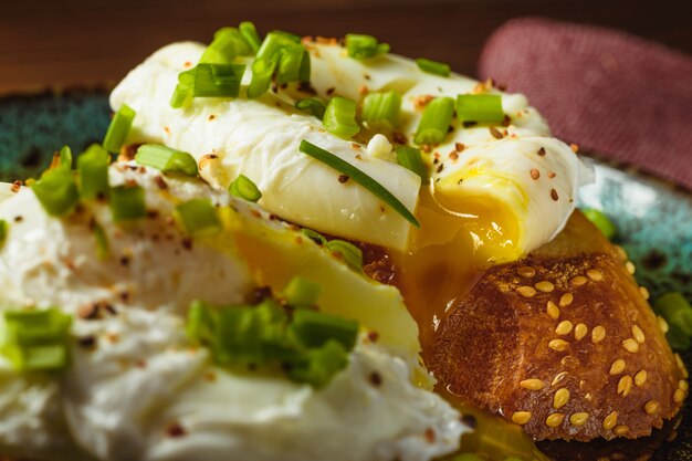 Poached eggs on baguette with greens