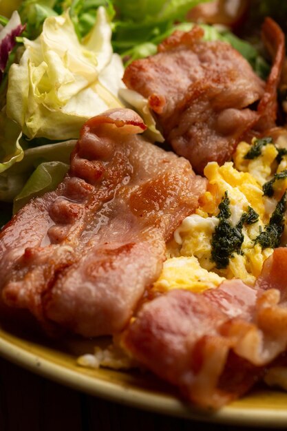 Poached eggs with vegetable ham tomatoes red beans and sourdough toast isolated on wood background Homemade food Tasty breakfast