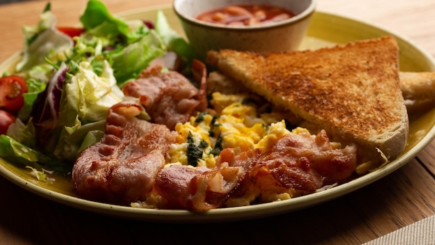 Poached eggs with vegetable ham tomatoes red beans and\
sourdough toast isolated on wood background homemade food tasty\
breakfast