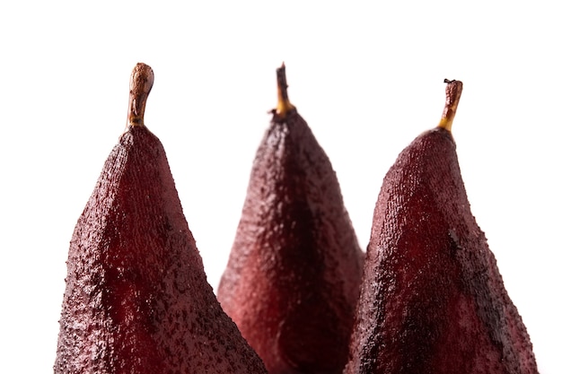 Poached pears in red wine isolated on white