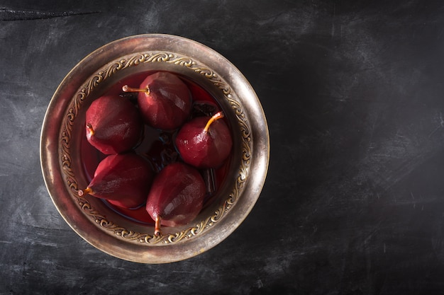 Poached pears in red wine with cinnamon and anise