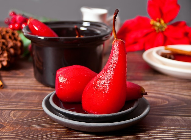 Photo poached pears in red wine with spices.