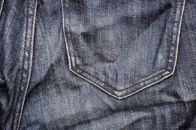 Pocket on grey jeans background or texture