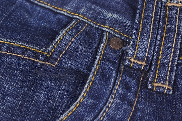 Photo pocket and rivet on jeans. stitched texture jeans background.