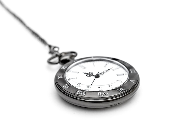 Pocket watch on chain on white