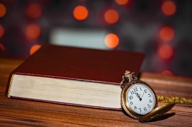 Pocket watch with book background