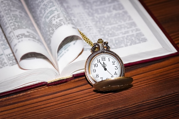 A pocket watch with book